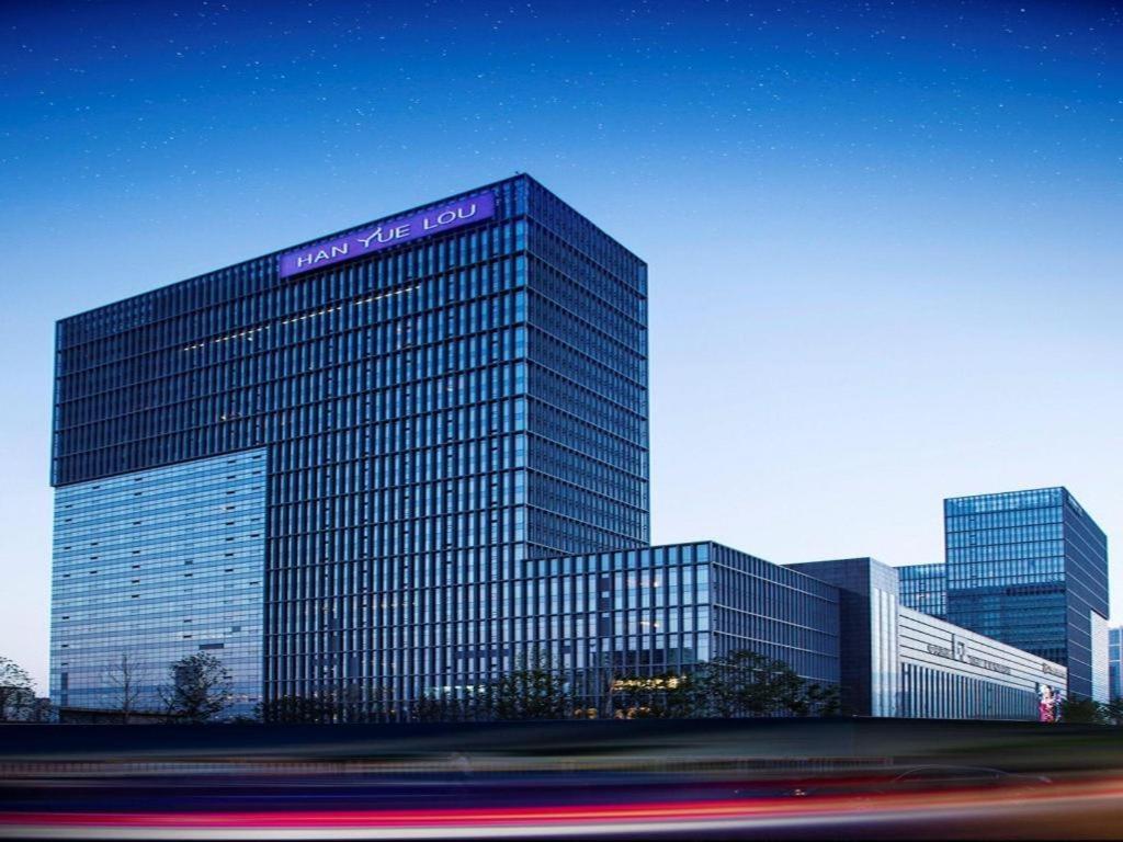 a large building with a sign on the side of it at Han Yue Lou Hotel Nanjing in Nanjing