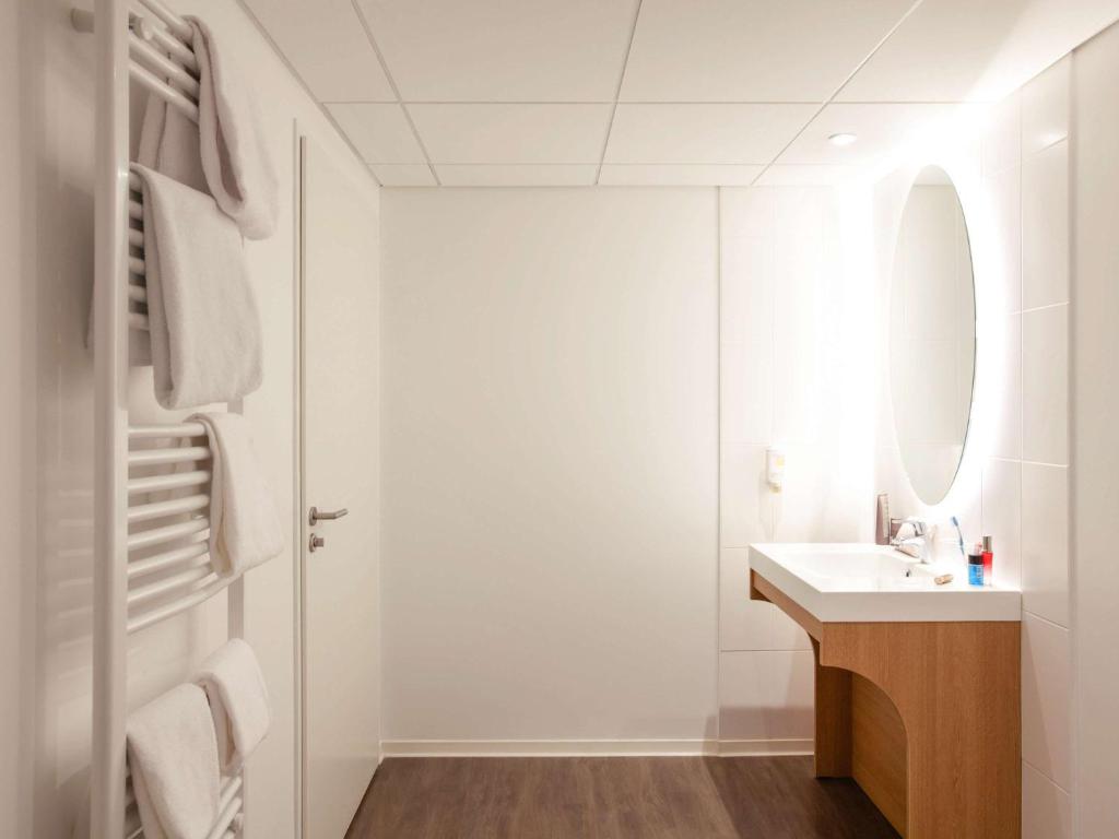 Koupelna v ubytování Aparthotel Adagio Access Nancy Centre