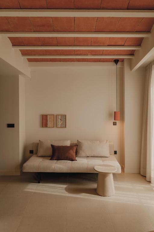 Postel nebo postele na pokoji v ubytování Pau Suites