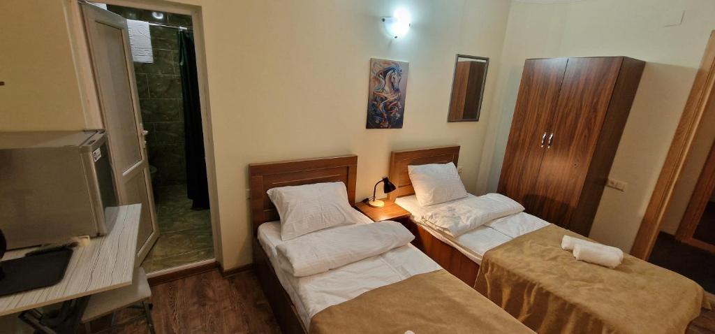 Postel nebo postele na pokoji v ubytování Karakum Batumi