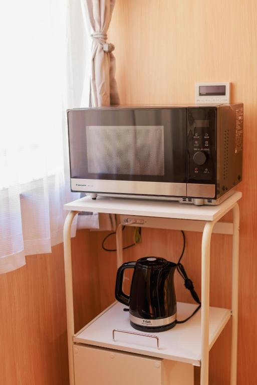 Kuchyň nebo kuchyňský kout v ubytování MKG Home・芝