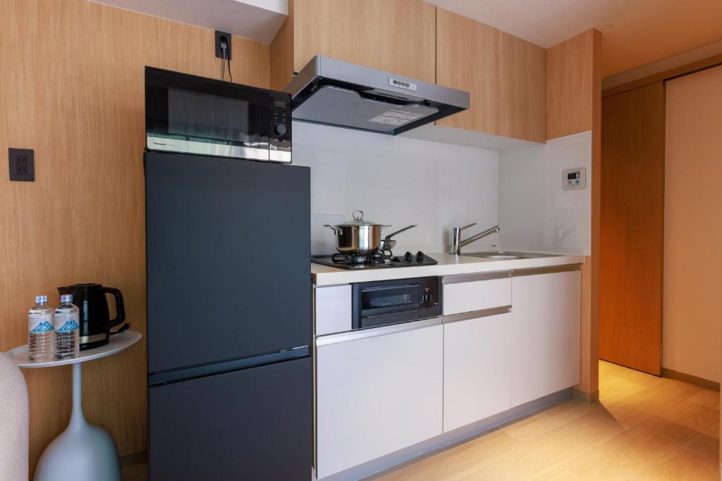 Kuchyň nebo kuchyňský kout v ubytování MKG Home・芝