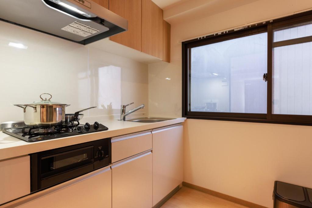 Kuchyň nebo kuchyňský kout v ubytování MKG Home・芝