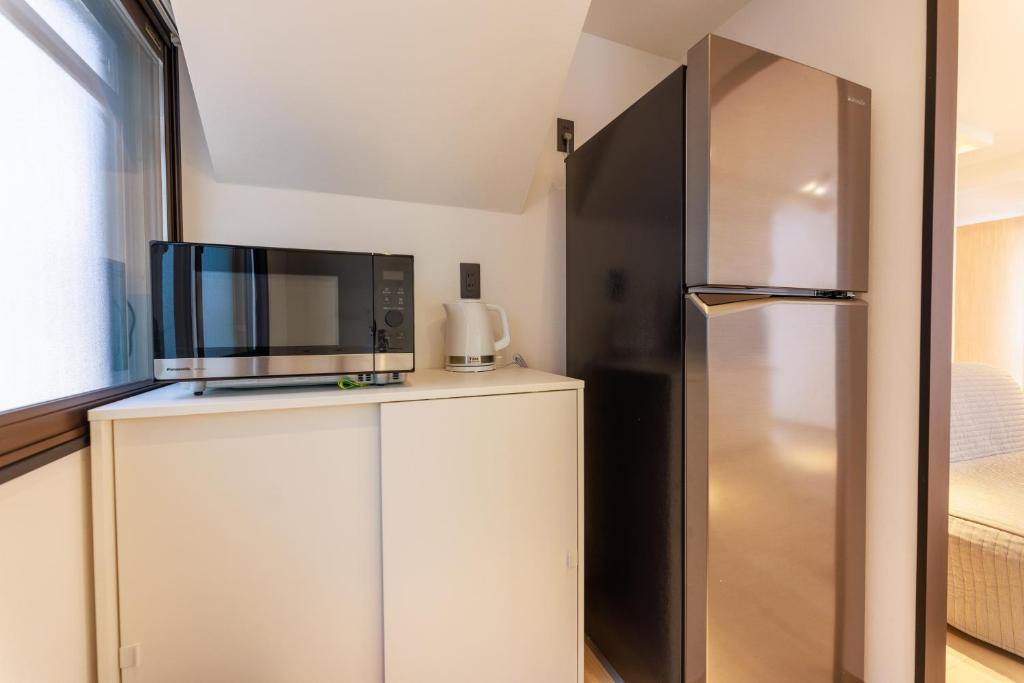 Kuchyň nebo kuchyňský kout v ubytování MKG Home・芝