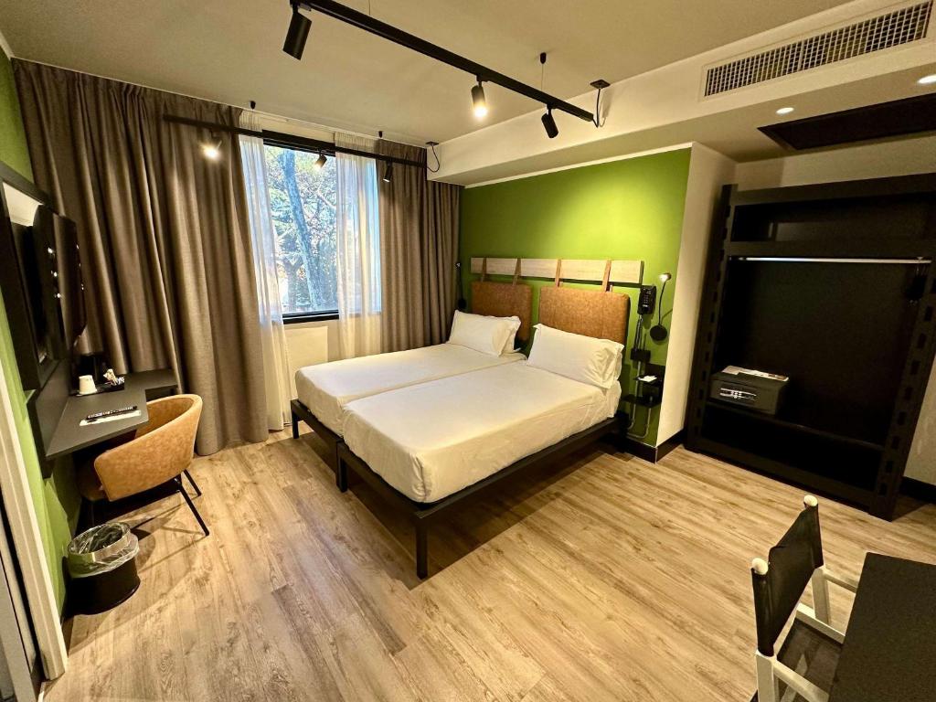 Letto o letti in una camera di Mercure Roma Cinecittà