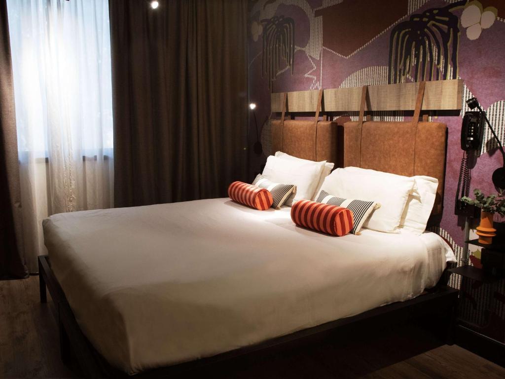 Letto o letti in una camera di Mercure Roma Cinecittà