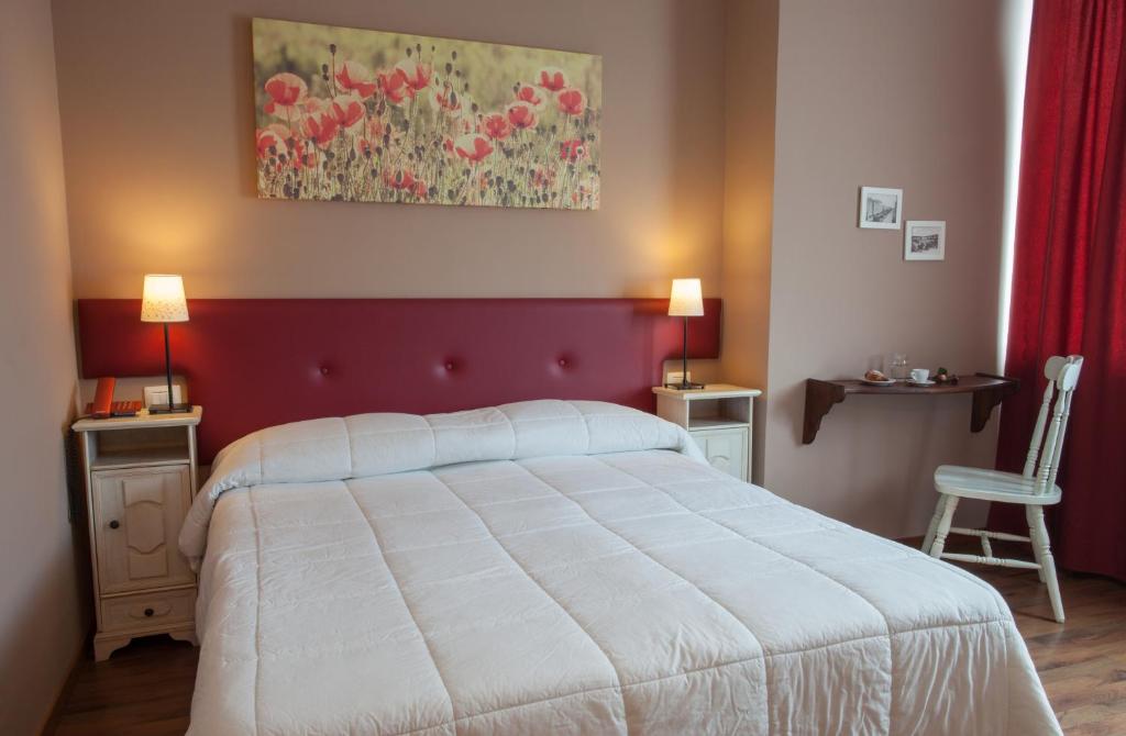 A bed or beds in a room at Ankon Hotel