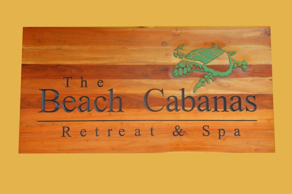 a sign for the beach calabasas retreat and spa at The Beach Cabanas Retreat & Spa in Koggala