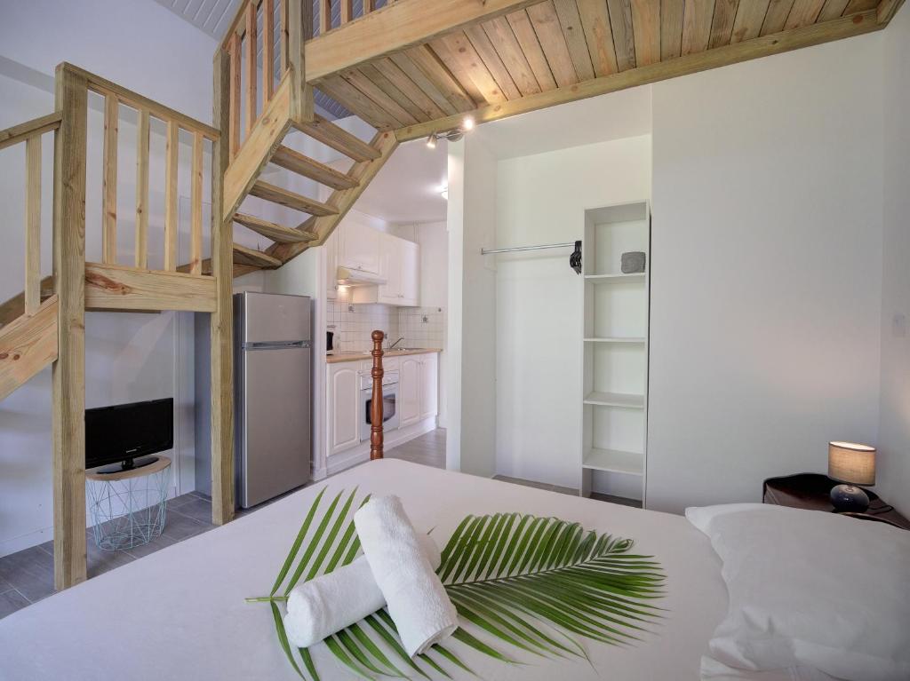 Postel nebo postele na pokoji v ubytování Résidence Ti'Kéol - Appartements avec terrasse 2 à 4 personnes, piscine
