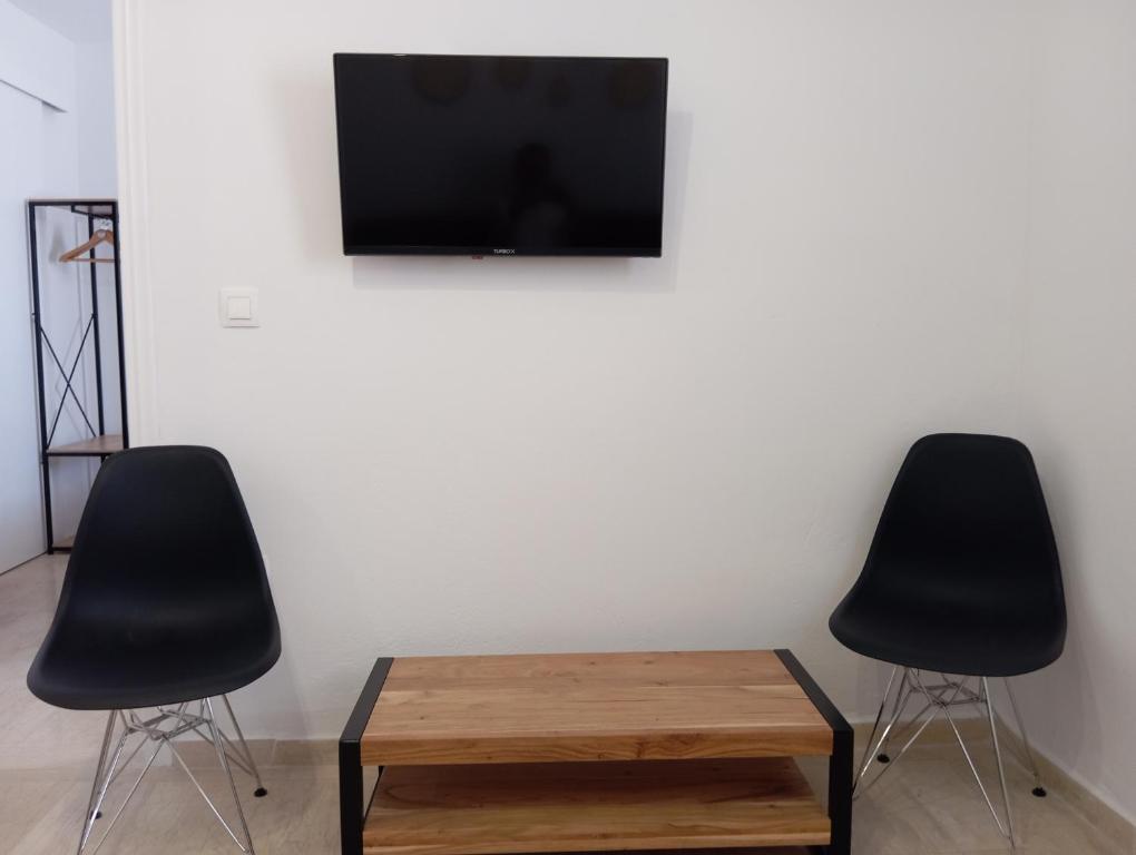 TV a/nebo společenská místnost v ubytování Captain's Studios