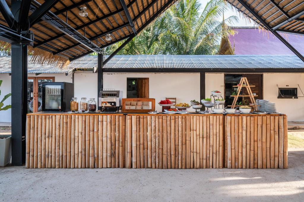 a wooden fence in front of a house at Kokotel Khao Lak Lighthouse in Khao Lak