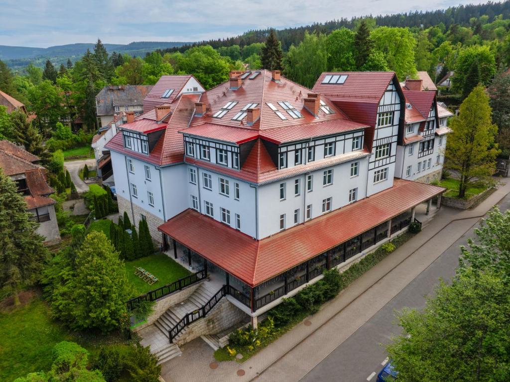 an overhead view of a large white building with a red roof at Medical Sensus in Polanica-Zdrój