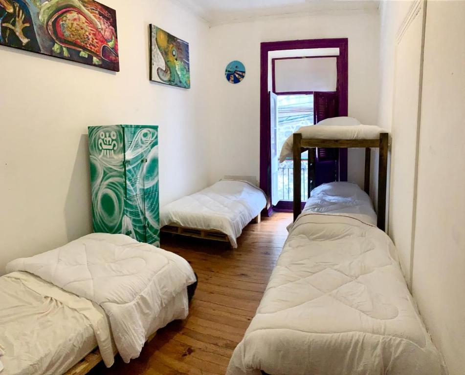 Uma cama ou camas num quarto em Art Hostel Casa Chaman