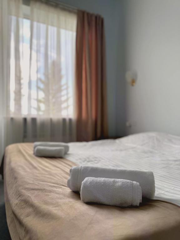 Postel nebo postele na pokoji v ubytování Blue Sevan Hotel