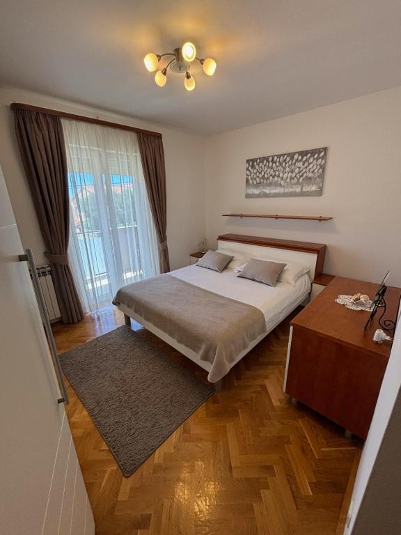 Łóżko lub łóżka w pokoju w obiekcie Kristina Apartments