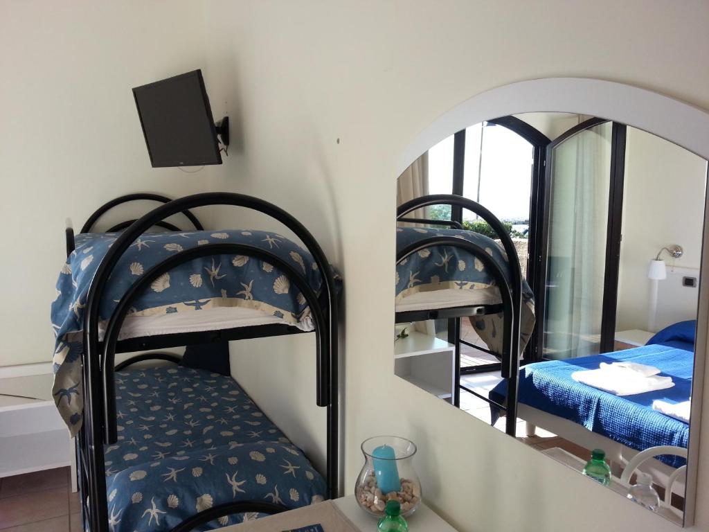 Postel nebo postele na pokoji v ubytování Hotel Tirreno Formia