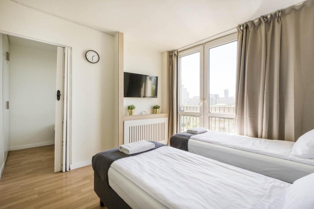 Posteľ alebo postele v izbe v ubytovaní Labo Apartment Żelazna Brama