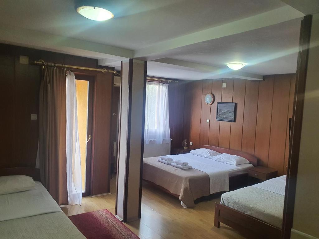 Postel nebo postele na pokoji v ubytování Guest house Vila Bor