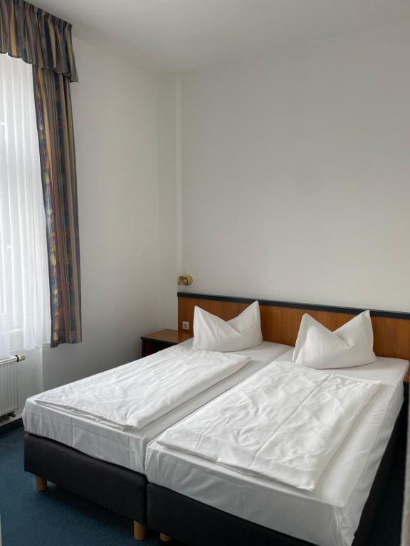 Postel nebo postele na pokoji v ubytování Hotel Krone