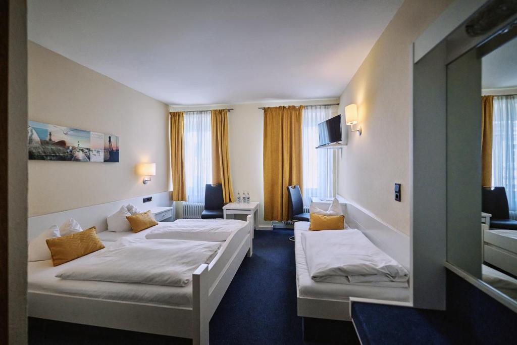 Postel nebo postele na pokoji v ubytování Herdegen Rooms - Self Check-in