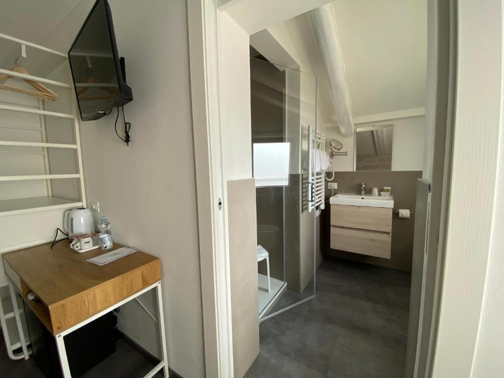 a small kitchen with a wooden table in a room at Boutique Hotel Nuovo Cason in Cavallino-Treporti