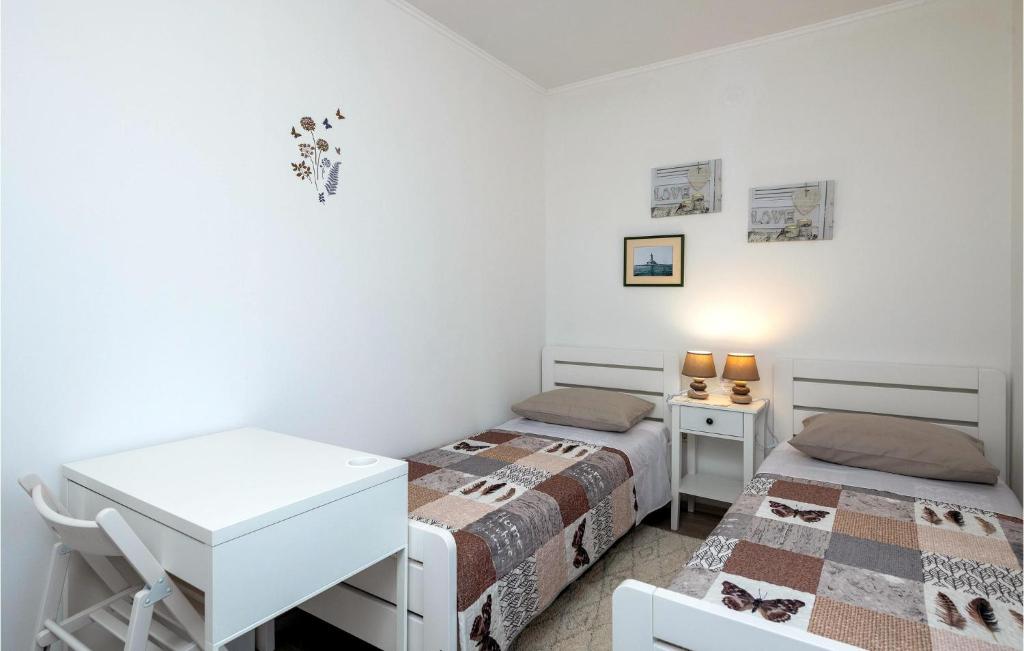 Postel nebo postele na pokoji v ubytování Holiday Home Marcana Filipana