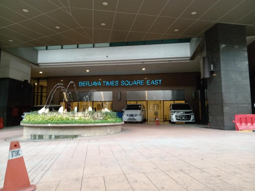 a parking lot with cars parked in a building at Standard Times Square Suite Kuala Lumpur in Kuala Lumpur