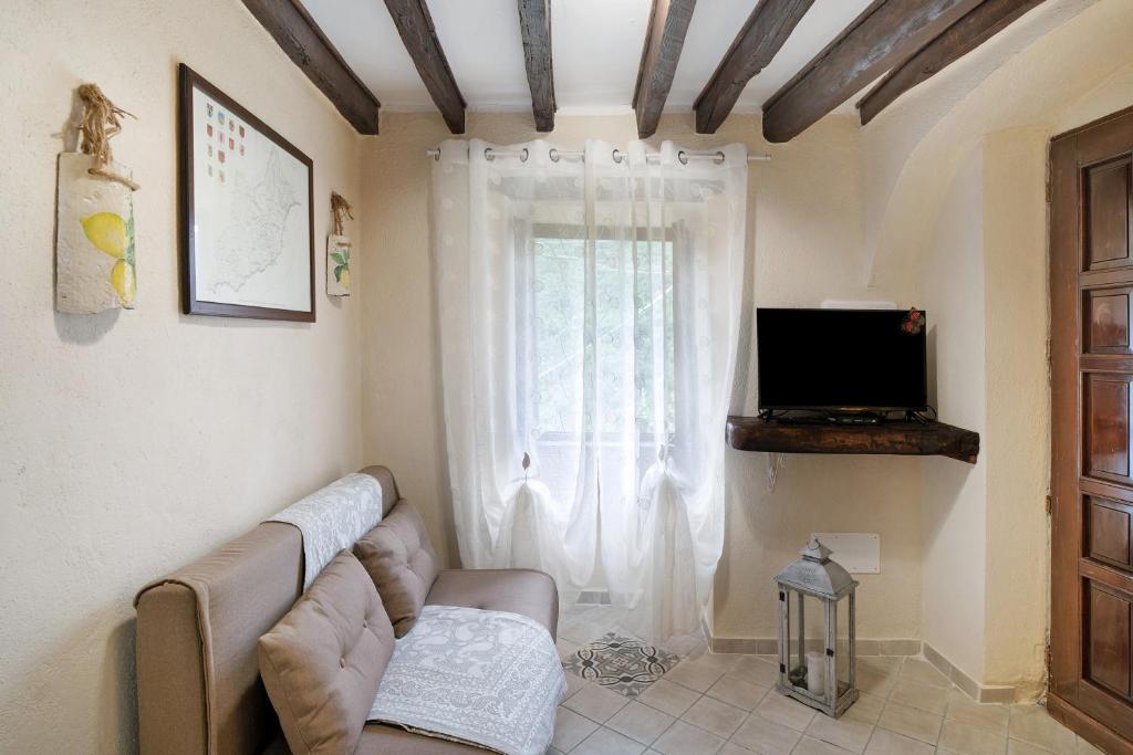 TV a/nebo společenská místnost v ubytování Agriturismo U' Spigu Nonna Annetta