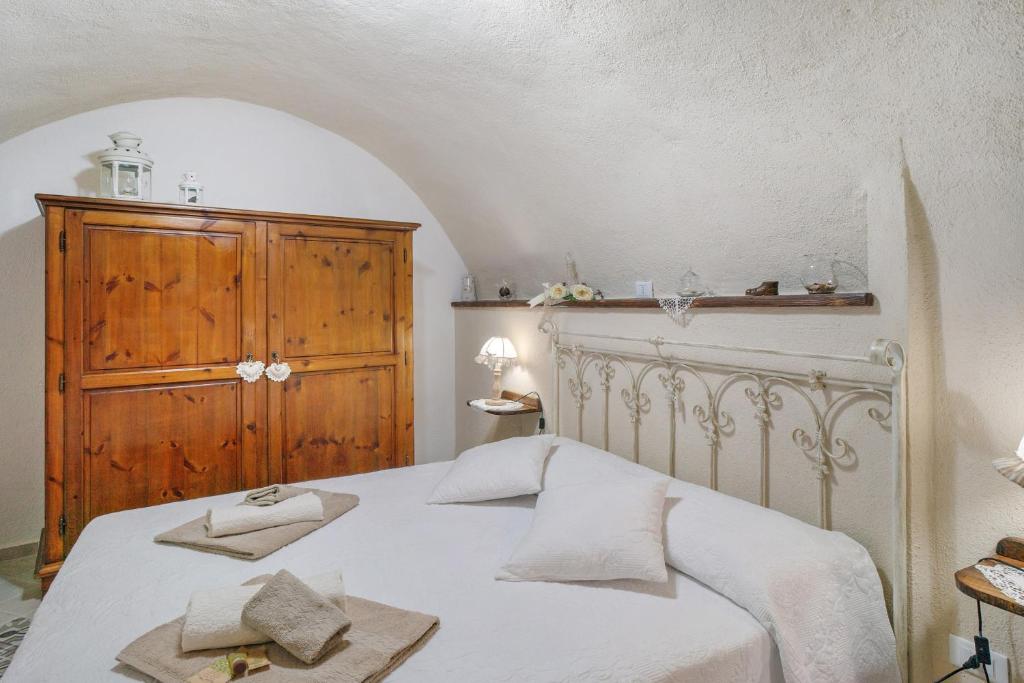 Postel nebo postele na pokoji v ubytování Agriturismo U' Spigu Nonna Annetta