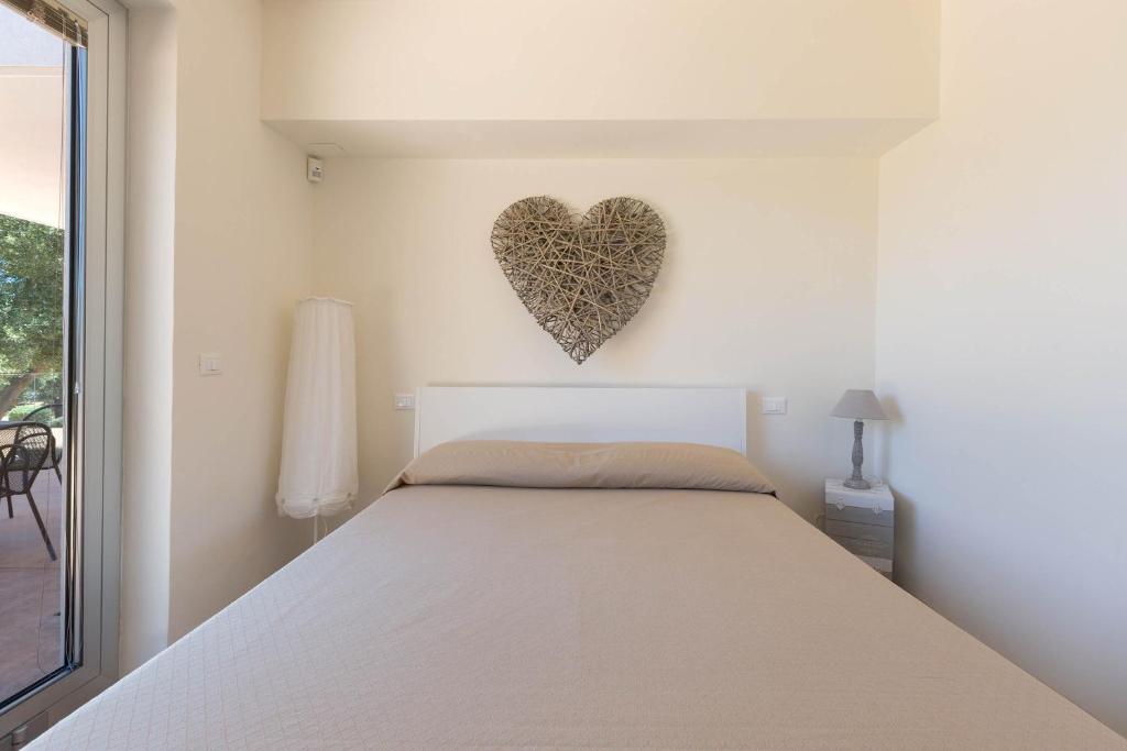Łóżko lub łóżka w pokoju w obiekcie Villa Lisy by Perle di Puglia