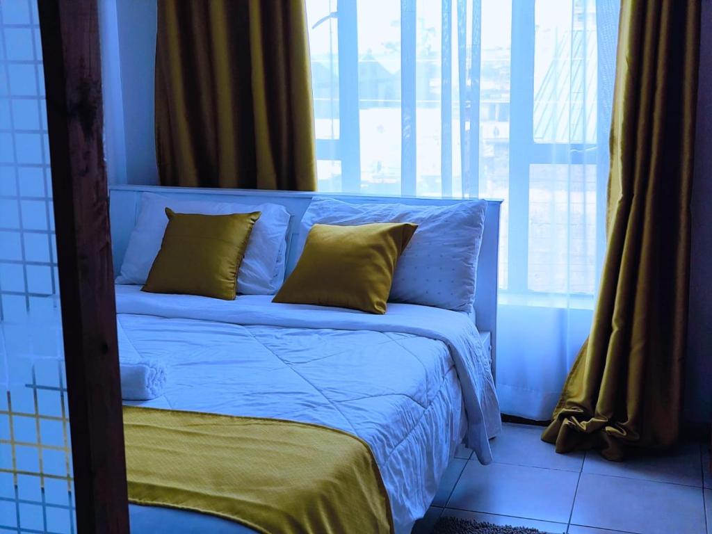 Postel nebo postele na pokoji v ubytování Baibai Homes Rm 204 &114