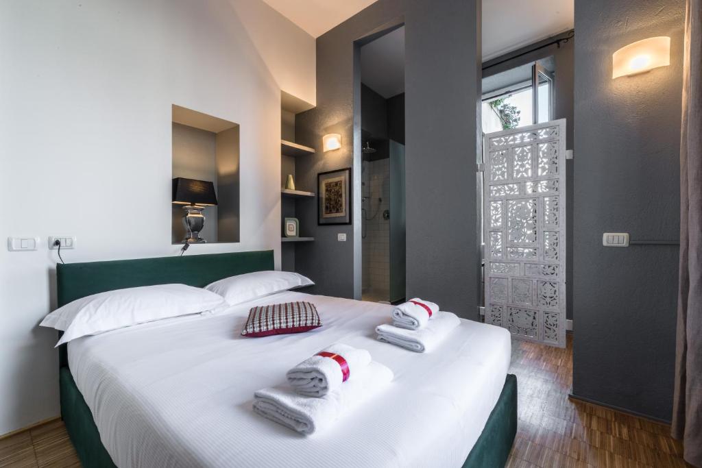 Postel nebo postele na pokoji v ubytování Porta Venezia Open Space - Due passi dal Duomo - 2 bagni