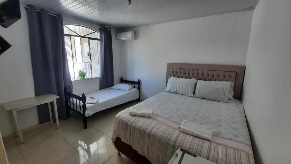 Postel nebo postele na pokoji v ubytování Hotel Dal Gobo