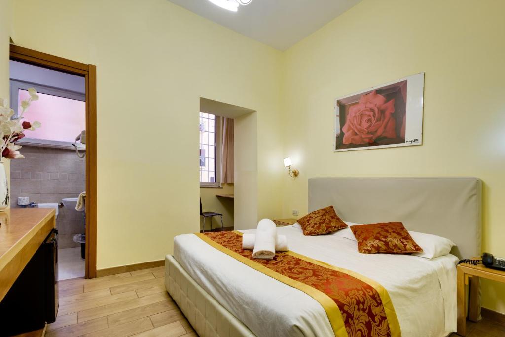 Postel nebo postele na pokoji v ubytování Hotel Terminal