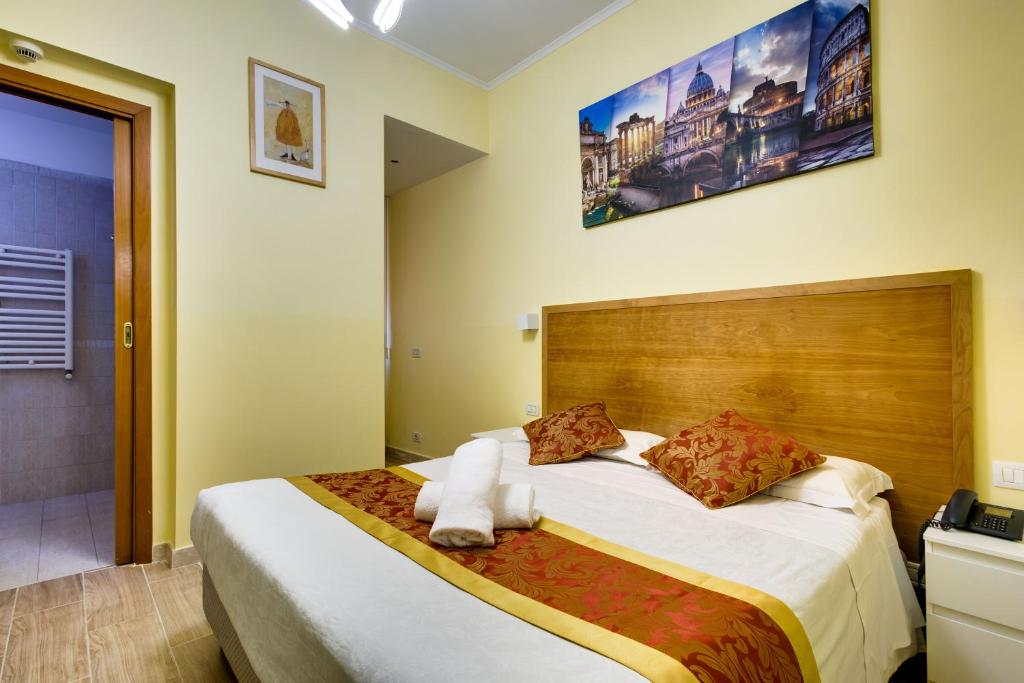 Postel nebo postele na pokoji v ubytování Hotel Terminal