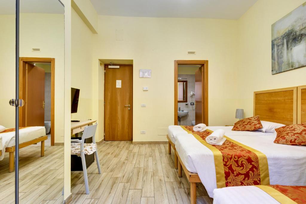 Postel nebo postele na pokoji v ubytování Hotel Terminal