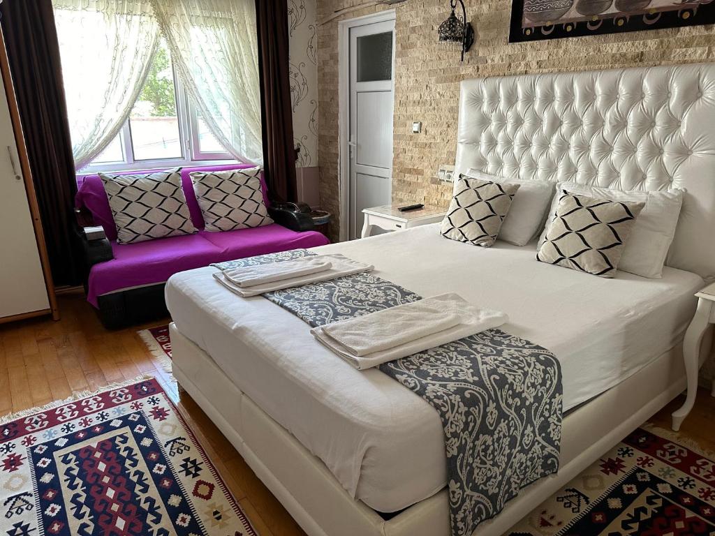 Ένα ή περισσότερα κρεβάτια σε δωμάτιο στο Sinter Terasse House Hotel