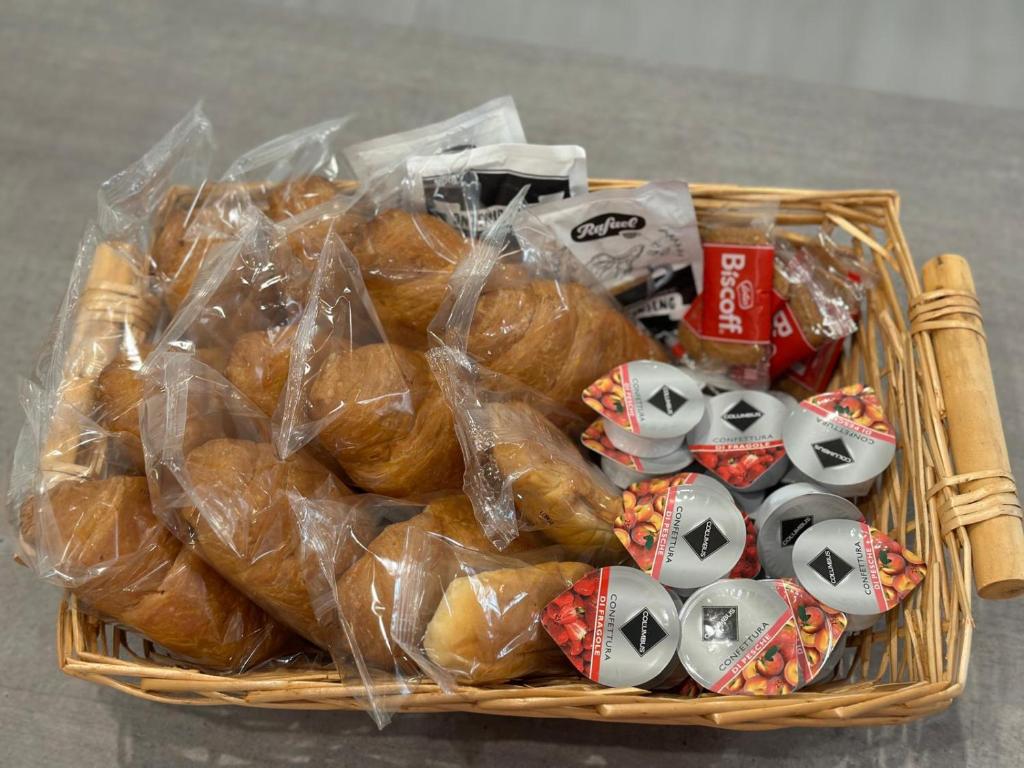 a basket filled with buns in plastic bags at Bari Lory’s Home in Bari