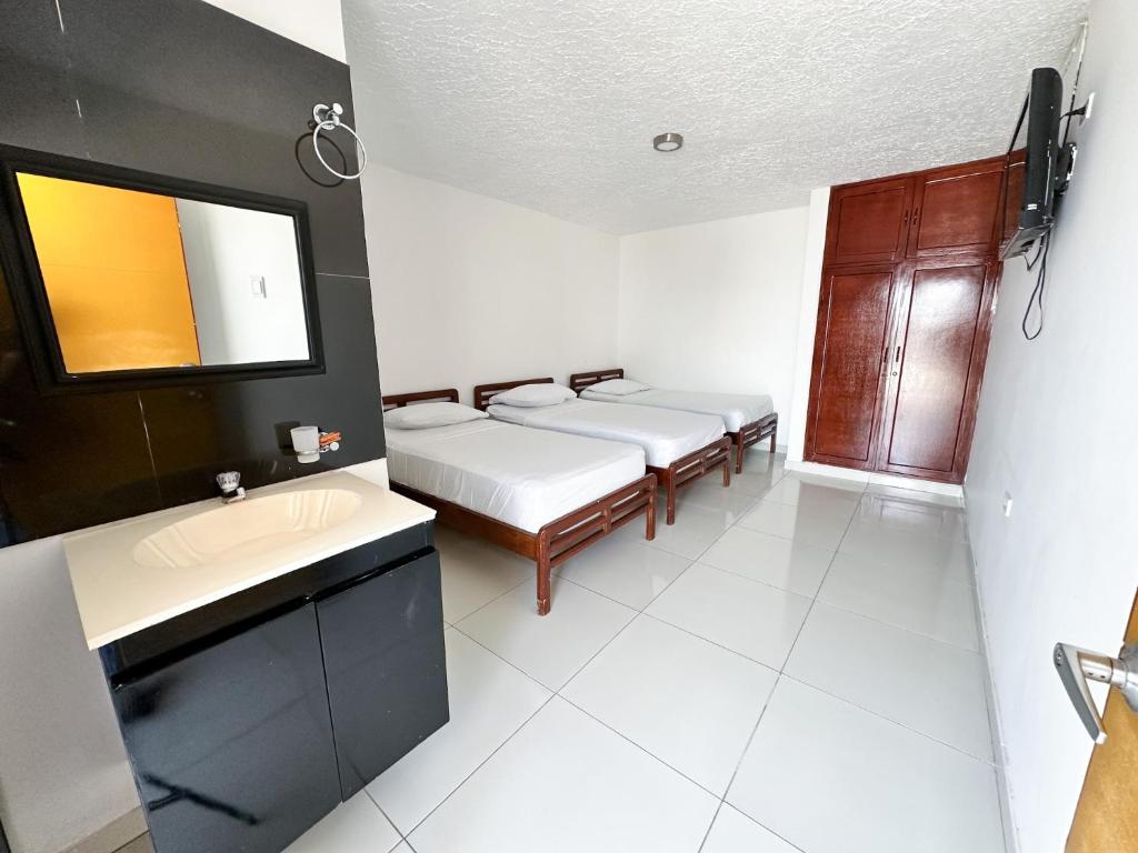 Kuchyň nebo kuchyňský kout v ubytování Hotel Winsor