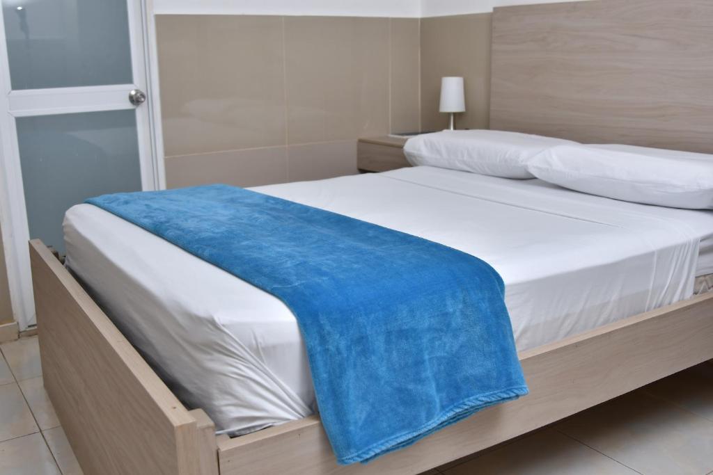 Postel nebo postele na pokoji v ubytování Hotel Winsor