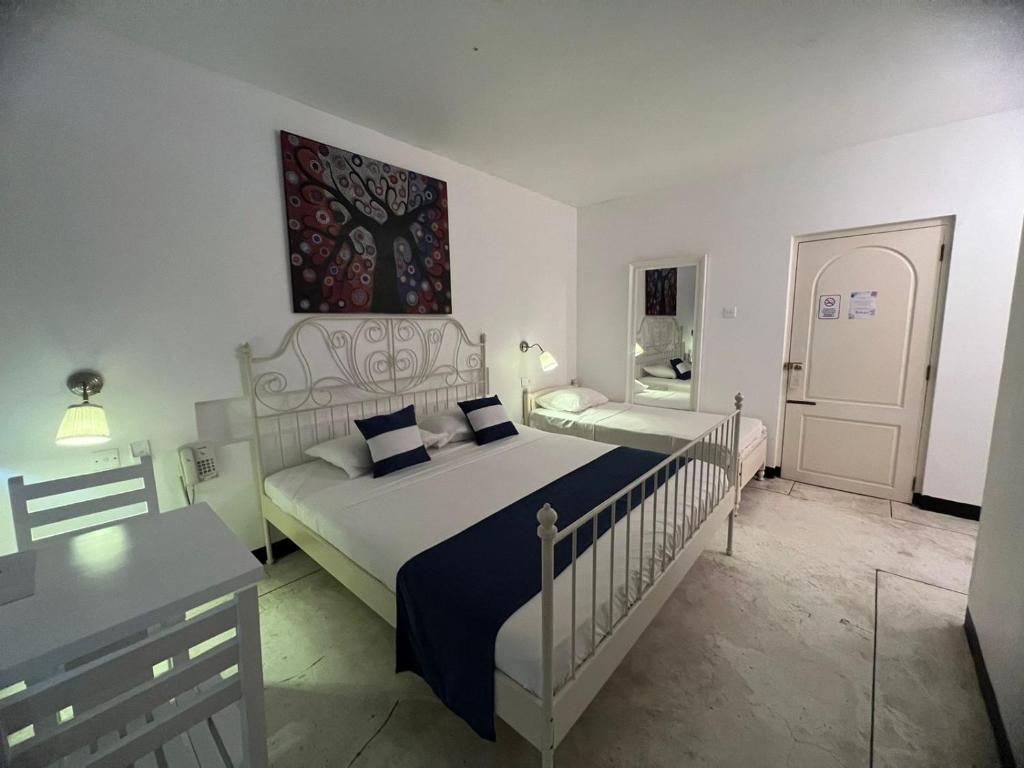 Postel nebo postele na pokoji v ubytování Beverly Villa