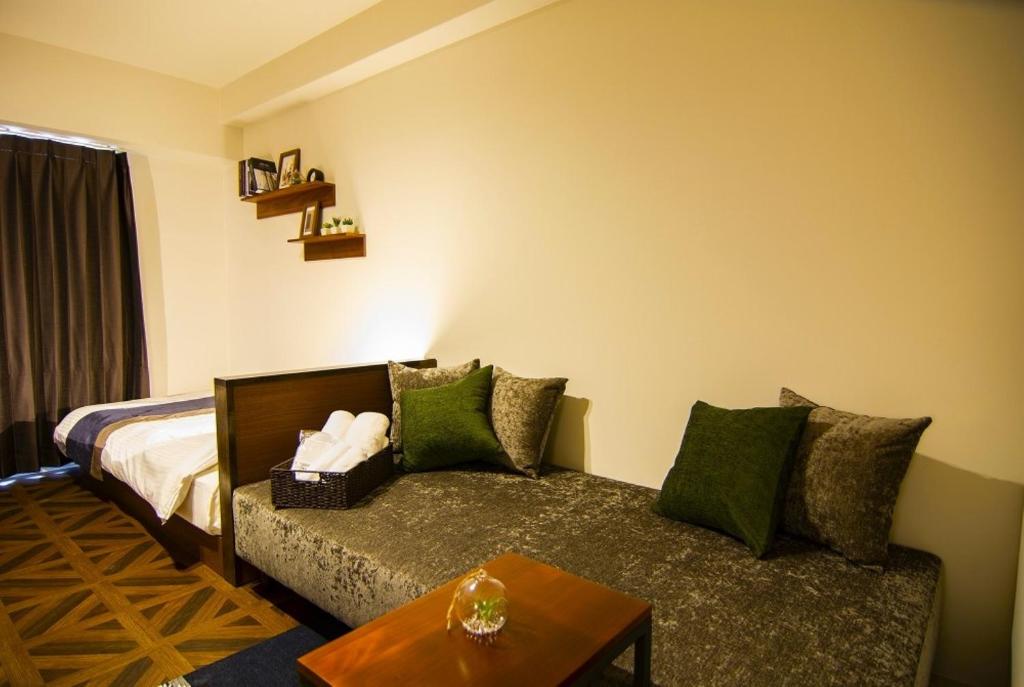 Postel nebo postele na pokoji v ubytování e-stay ebisu