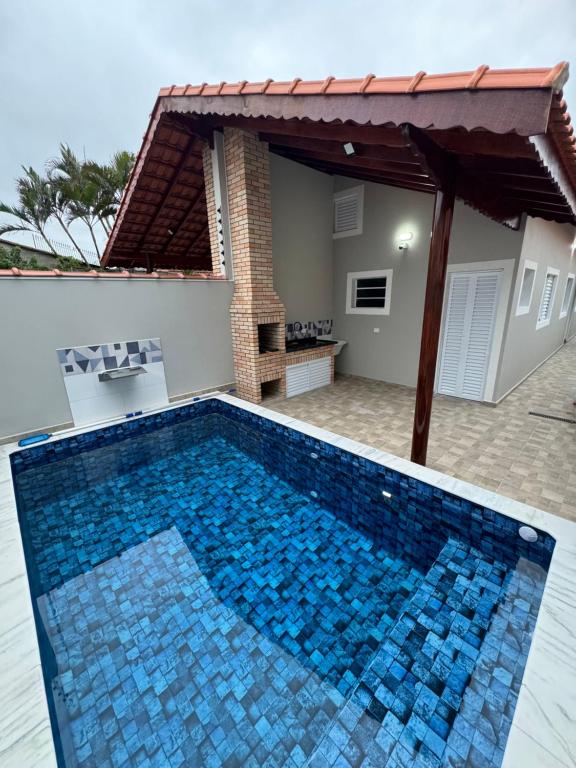 Bazén v ubytování Casa nova na praia com piscina - Mongaguá nebo v jeho okolí