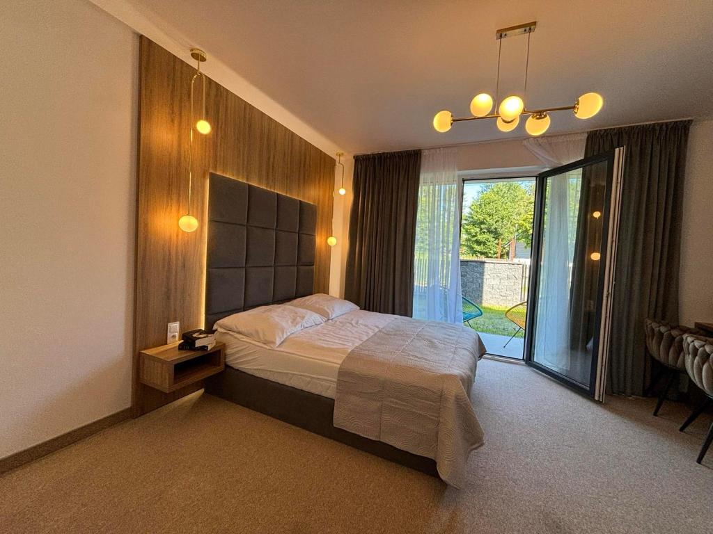 Postel nebo postele na pokoji v ubytování Resort Eden Premium