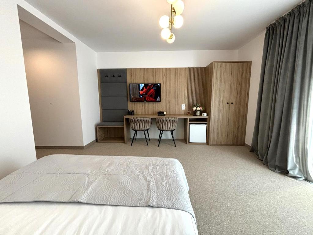 Postel nebo postele na pokoji v ubytování Resort Eden Premium