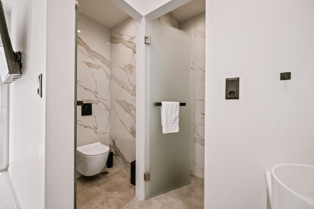 Koupelna v ubytování Plānis Str Urban Suites by Semavί