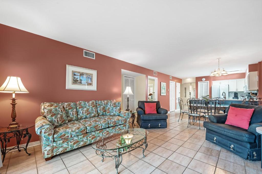 a living room with a couch and chairs and a table at 6512 Gulf Shores Plantation-Palms in Gulf Shores