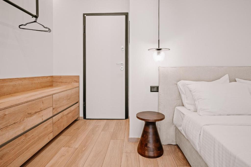 Postel nebo postele na pokoji v ubytování Plānis Str Urban Suites by Semavί