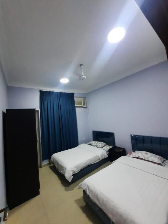 Postel nebo postele na pokoji v ubytování Salalah-Al Shwamekh Suites