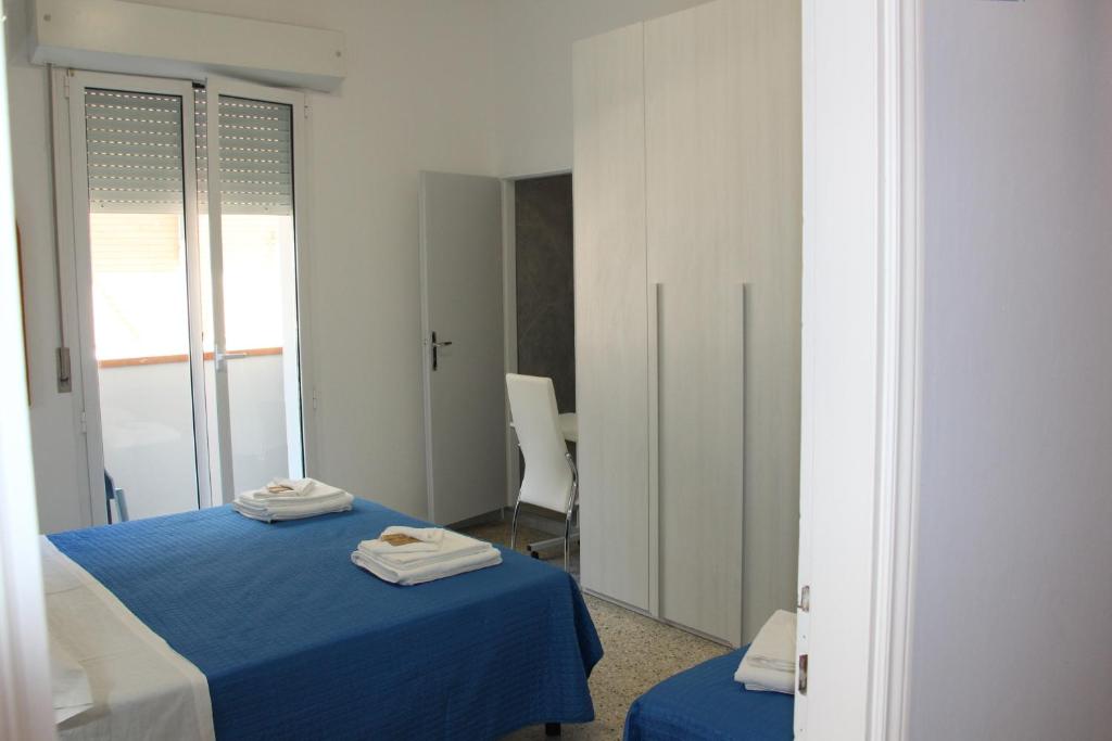 Postel nebo postele na pokoji v ubytování Martina's Hotel